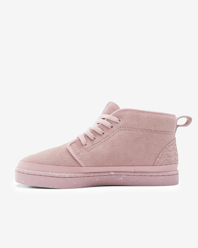 Dirty Pink Chukka being displayed on a white background from the interior side angle, highlighting the stitch construction and texture of the shoe.