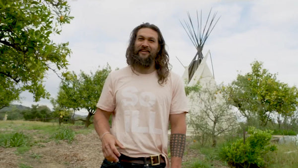Jason Momoa is shown wearing the So iLL pink on pink stacked logo tee