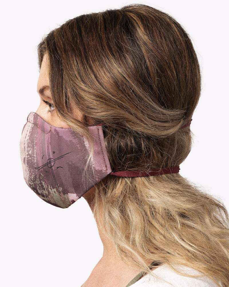 jason momoa collaboration on the roam x so ill face mask in camo color on a woman's profile