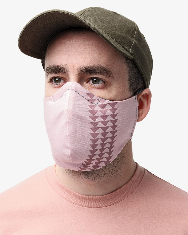 Front view of male wearing So iLL x On The Roam Dirty Pink face mask