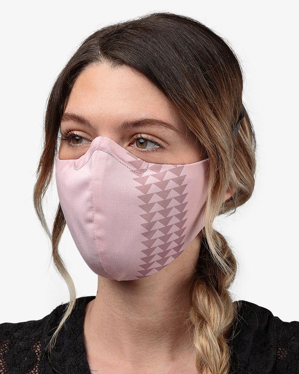 Female wearing Dirty Pink So iLL x On The Roam face mask  Edit alt text
