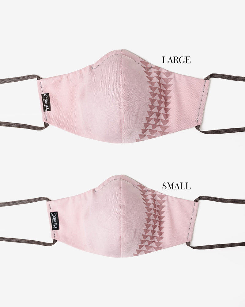 Front view of So iLL x On The Roam Dirty Pink face mask lying flat.  showing small and large comparison.
